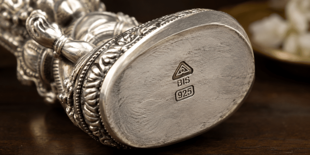 BIS hallmark purity stamp on a silver Perumal idol base